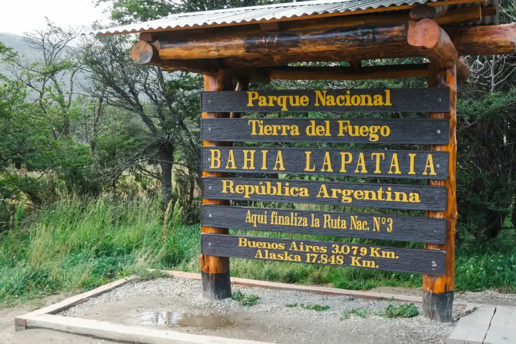 A sign shows where the Pan American Highway ends in the Fuego del Mondo National Park near Ushuaia, Argentina